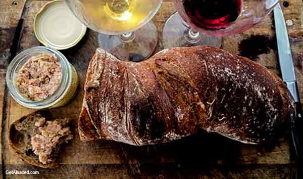 french bread, wine on a table in alsace france