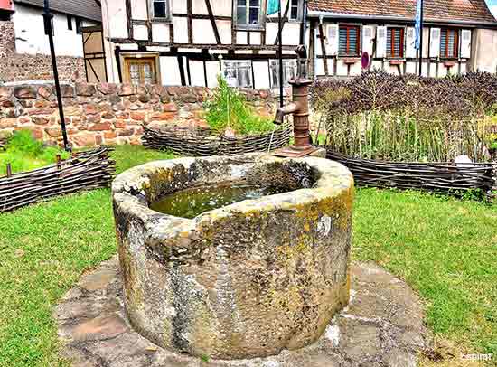 village houses and a well in the Alsace region of France