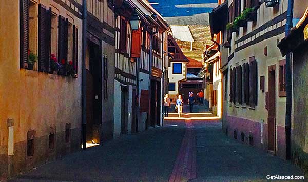 small village street on the Alsace wine road in Alsace France