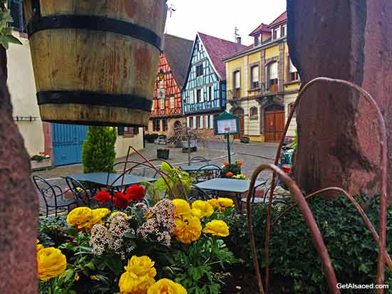village flowers and houses in Kientzheim in Alsace France